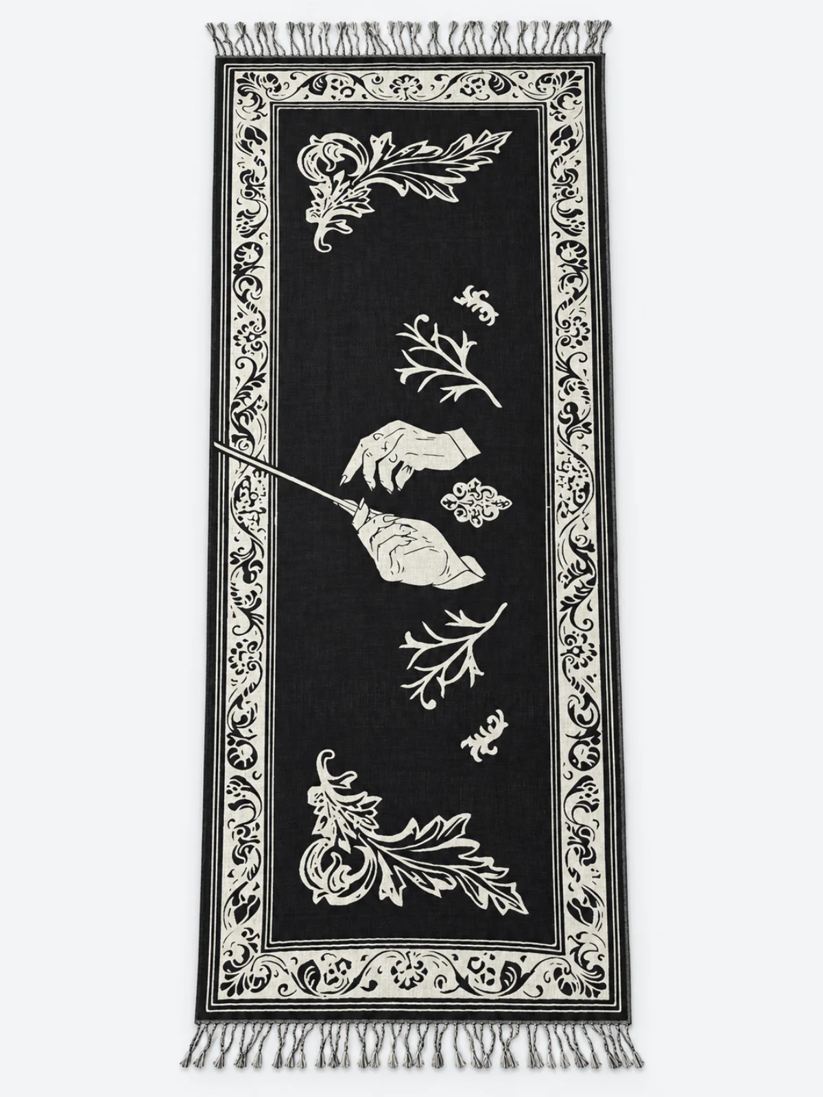 Black and ivory woven scarf with an ornamental border and fringed finish