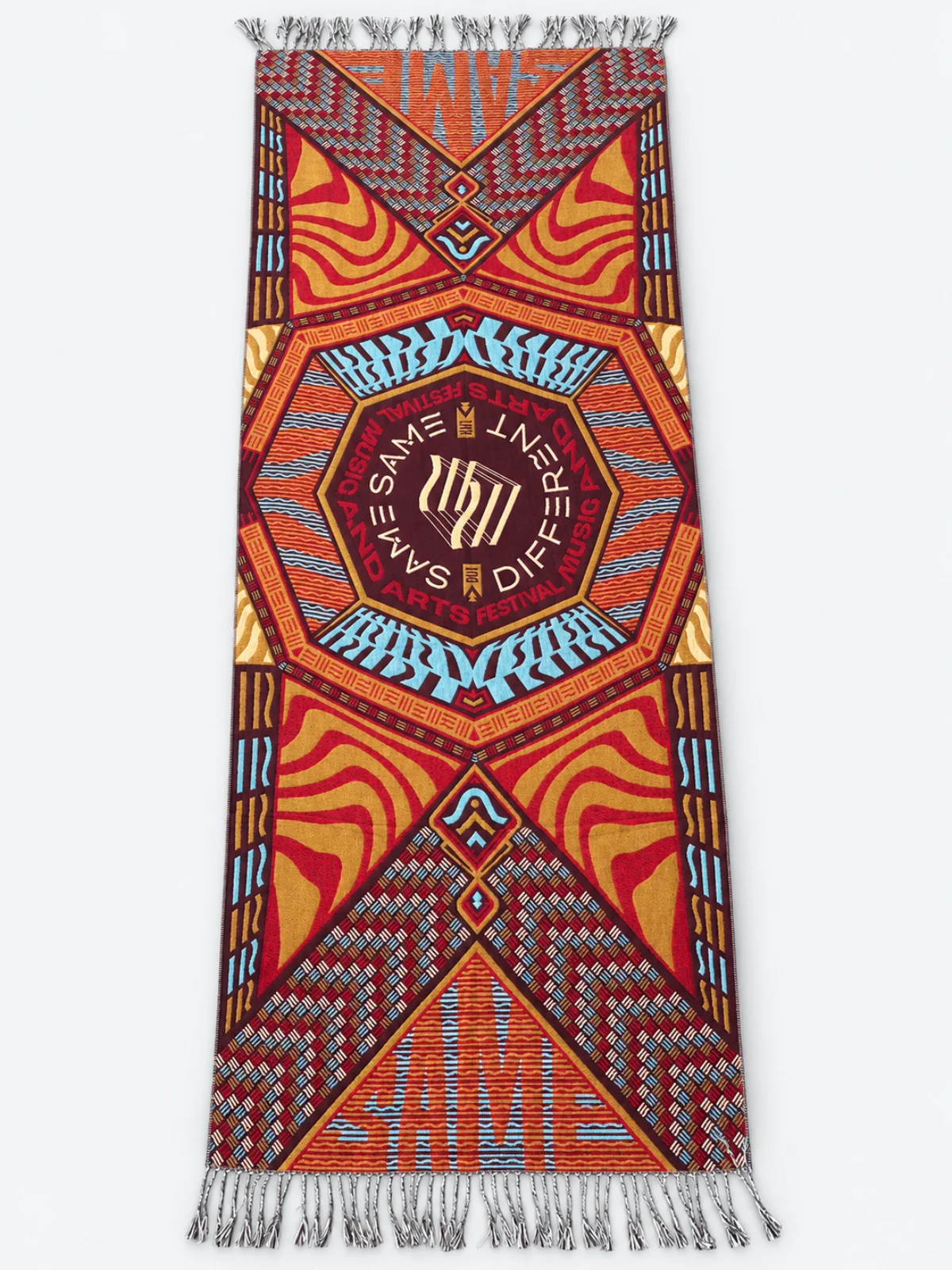 Rust, gold and blue woven sample with layered geometric motifs